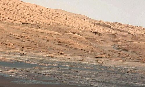 Handout photo of NASA’s Curiosity Rover with view of Mt Sharp