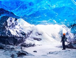 Traveller Visiting Ice Cave With Amazing Eye-catching Scenes